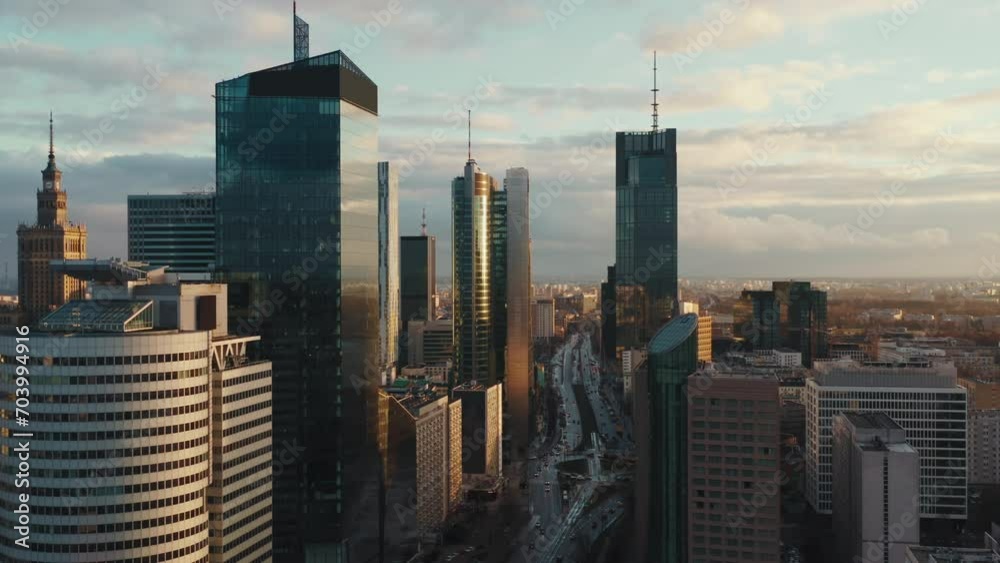 Aerial panorama of downtown glass skyscrapers. Cinematic drone shot morning cityscape skyline, high-rise modern architecture buildings, big city financial district, no logos and advertising billboards