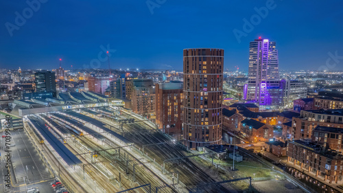 Leeds train station  West Yorkshire city centre aerial view. railway transport links. Illuminated at night view overlooking the city
