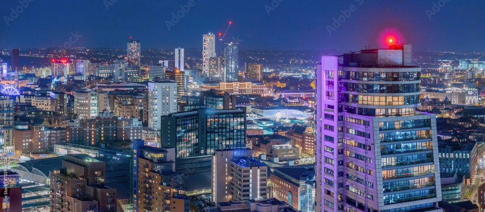 Naklejka premium Leeds West Yorkshire aerial view of the city centre at night looking north from near the train station