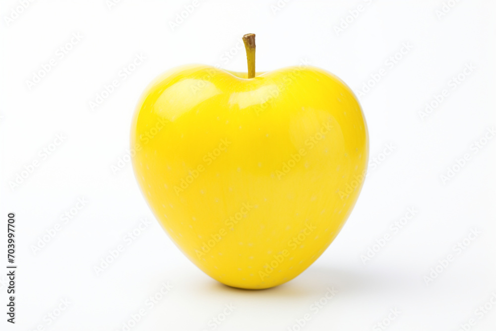 Obraz premium yellow delicious apple in the shape of a heart on a white isolated background,the concept of healthy nutrition,food styling,advertising banners for valentine's day