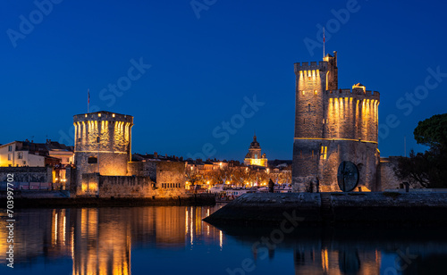 beautiful illuminated cityscape of the old harbor of La Rochelle