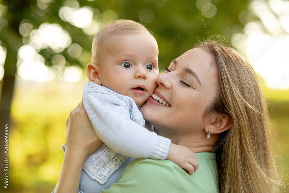 Happy mom and cute smiling baby boy. Positive human emotions, feelings, natural lifestyles. Family background. Happy mom and cute smiling baby boy. Positive human emotions, feelings, natural lifestyles. Family background.