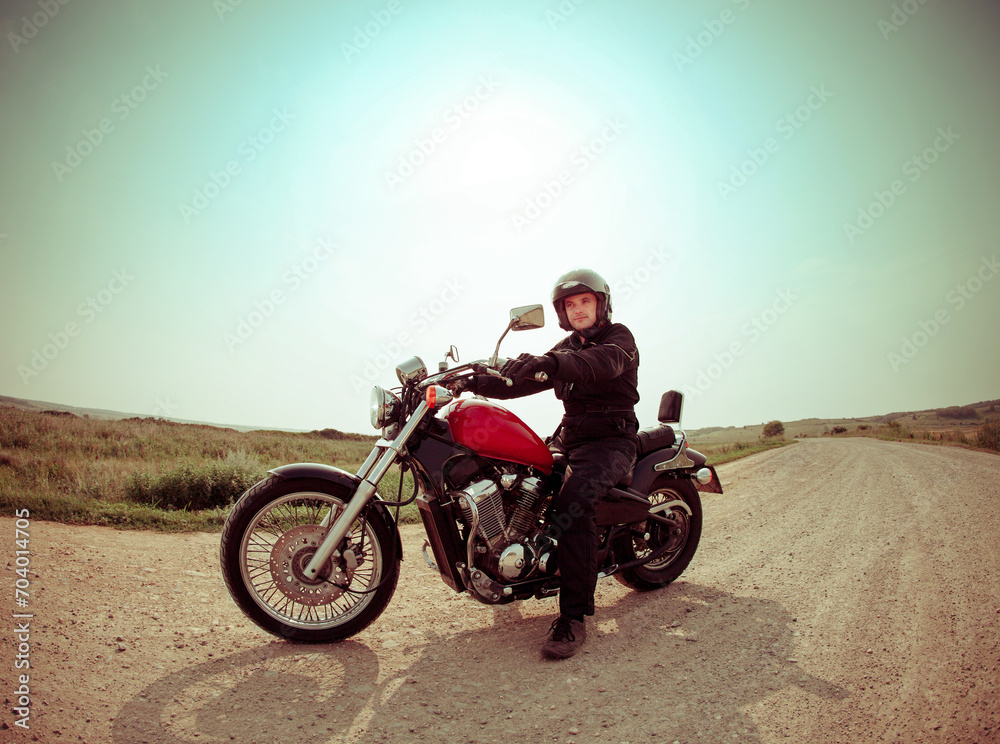 Biker on the road against the sky