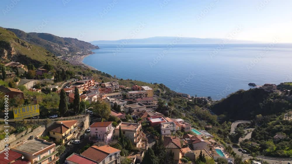 Taormina Sicily, Italy. Island Isola Bella, old town, Duomo square drone aerial view. Popular travel destination for summer vocation in Europe near Mediterrenian Sea Taormina Sicily, Italy. Island Isola Bella, old town, Duomo square drone aerial view. Popular travel destination for summer vocation in Europe near Mediterrenian Sea