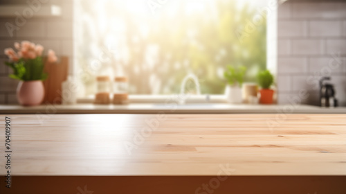 Empty wooden table top in the kitchen with kitchen utensil on the background  blurred background