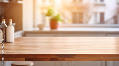 Empty wooden table top in the kitchen with kitchen utensil on the background, blurred background