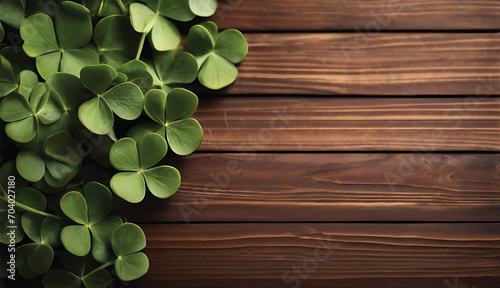 Green clover leaves on wooden background. St.Patrick's Day