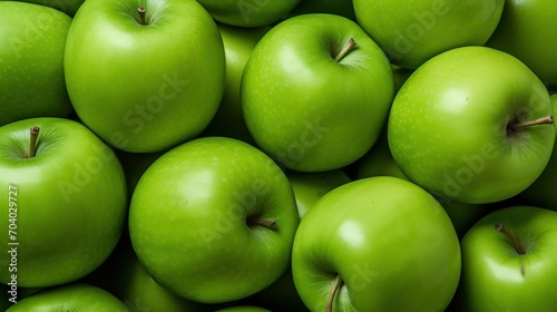  a large pile of green apples with one green apple in the middle of the middle of the pile and one green apple in the middle of the middle of the pile.