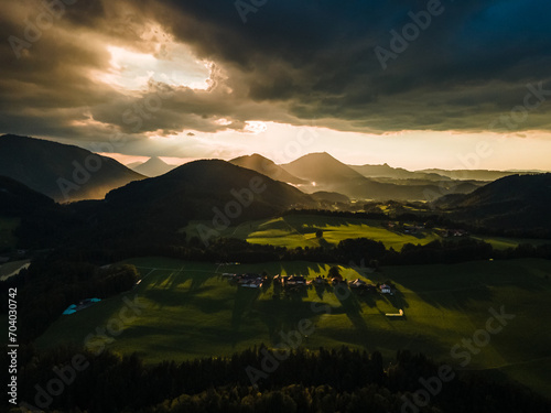 Golden Sunset Casting Warm Light Over Rolling Hills in the Austrian Countryside