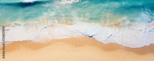 Aerial view of sandy beach  clear blue waves  and sunrays summer vacation banner with copy space  showcasing natural beauty and outdoor spa
