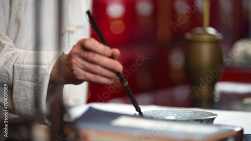 herbalist writing with chinese brush photo
