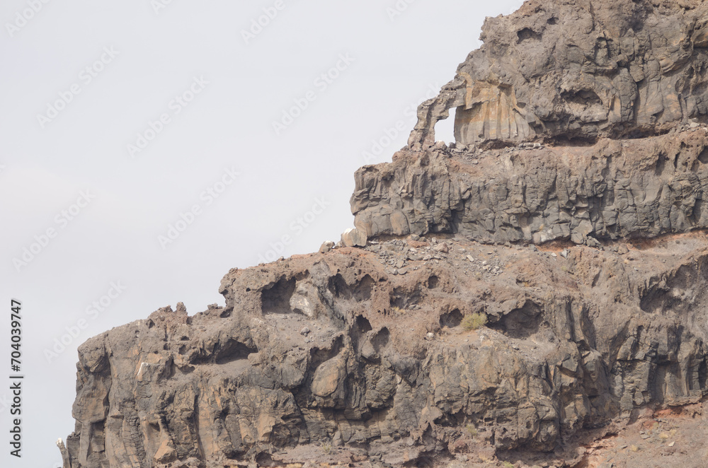 Natural hole in a sea cliff. Vallehermoso. La Gomera. Canary Islands. Spain.