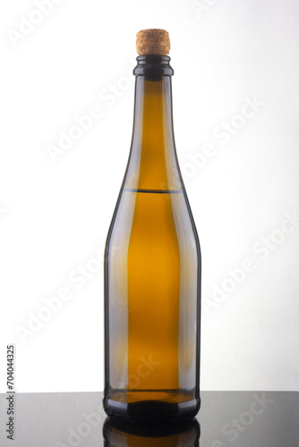 bottle of champagne wine closeup on a white background on a table