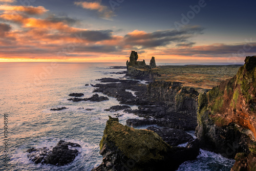 Volcanic cliffs of Londrangar over the Atlantic Ocean, Iceland photo
