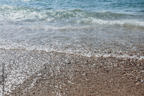 Fototapeta Naklejka Na Ścianę i Meble -  sea waves on the shore. relaxation on the beach by the sea. Mediterranean Sea. vacation in turkey