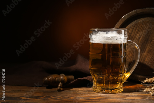 Mug of cold beer and wooden...