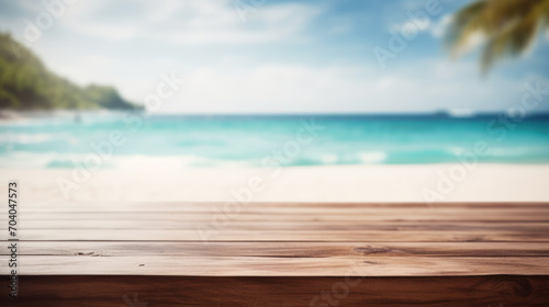 Sunny Shoreline View: Wooden Table with Beach and Sea in Blurred Background, Ideal for Summer Advertisements © raulince