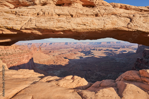 Mesa arch is a 27 foot long pothole arch that frames a beautiful view of the outstretched canyon below. Located in Canyonlands National park, this landmark is a very popular overlook © Daniel