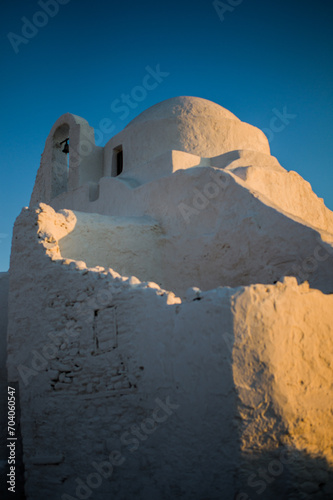 Sunset light on the most famous church of the Mykonos island the Panagia Paraportiani Aegean sea Greece photo