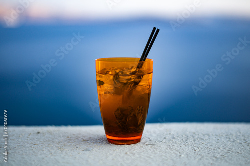 Mojito on a perfect day in Santorini cliff hotel with volcano view Oia village