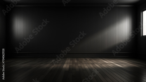Empty room with black wall, wooden floor and sunlight from the window. © Tida