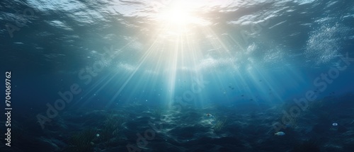 Sunlight penetrating ocean depths. Underwater marine scene.