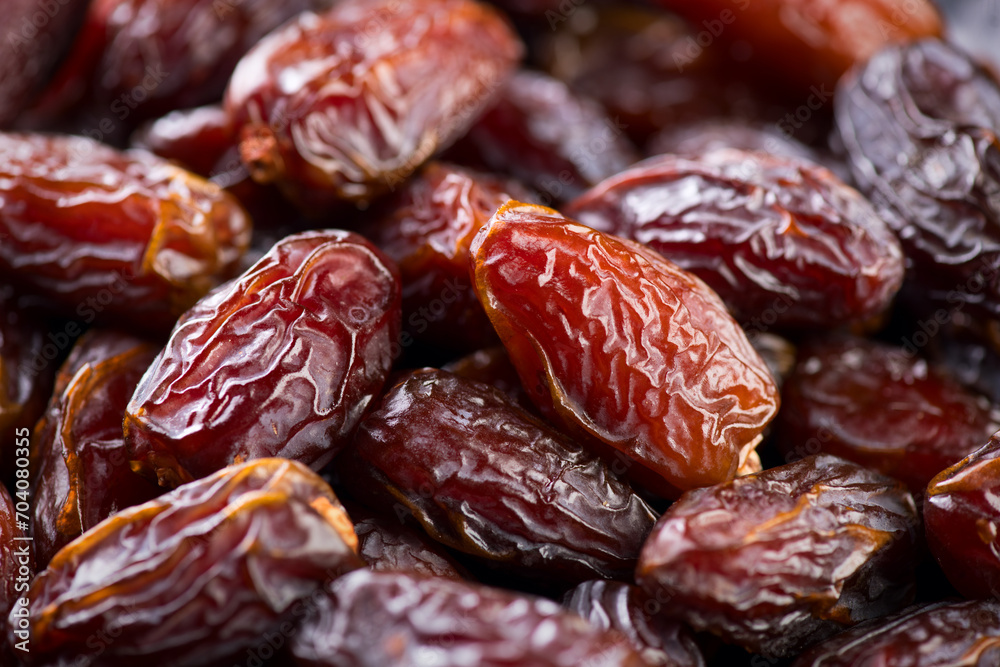 Date fruits. Dates fruit close up design background. Heap of Medjool dates close up, macro shot. Dried fruits, healthy vegan food