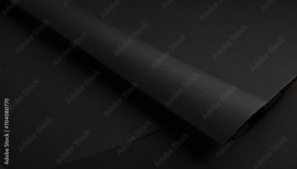 close up of a sheet of black paper with folds - obrazy, fototapety, plakaty 