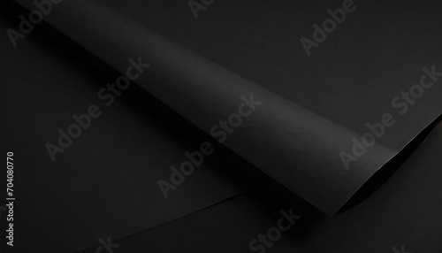 close up of a sheet of black paper with folds photo