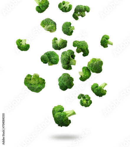 Fresh green broccoli falling on white background