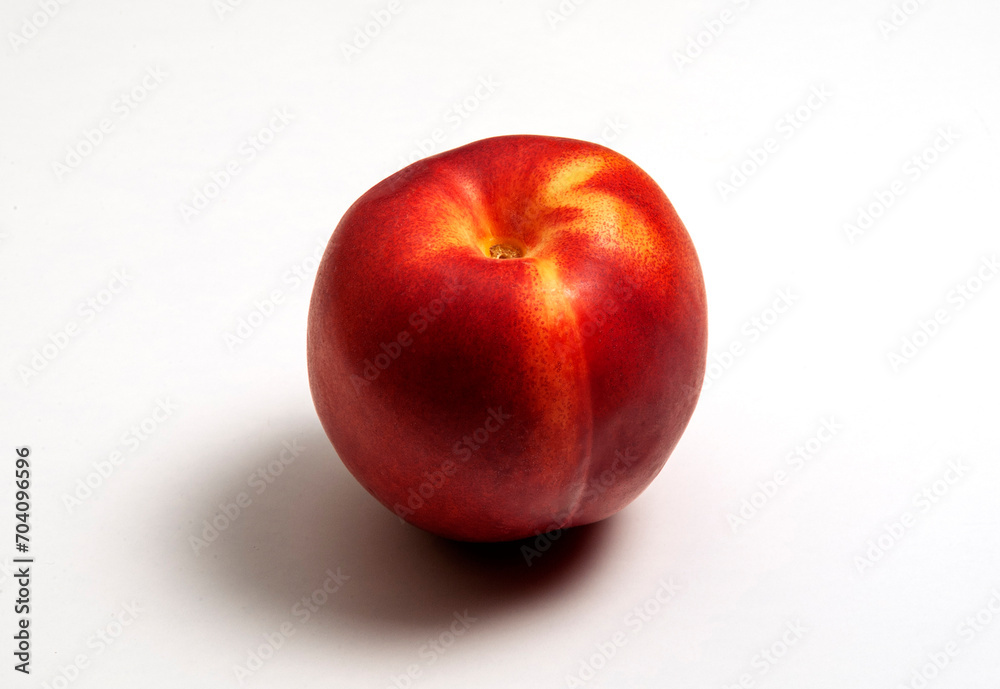 Whole nectarine with shadow on white background Whole nectarine with shadow on white background