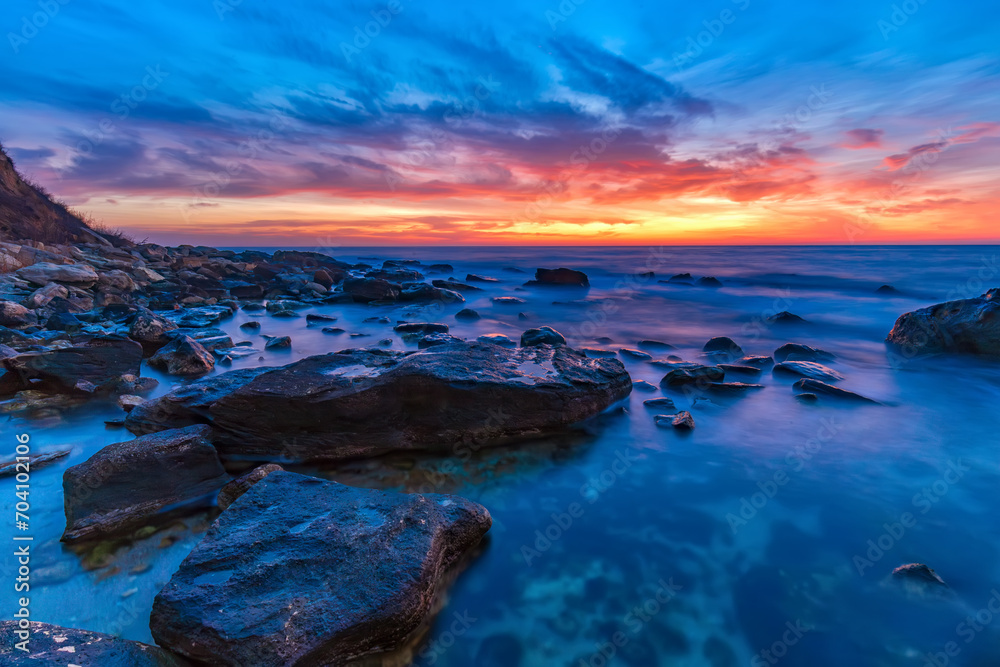 Naklejka premium Seascape during sunrise. Beautiful natural seascape, blue hour. Sea sunrise at the Black Sea coast.
