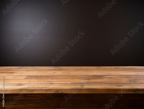 Rustic wooden table top on dark background