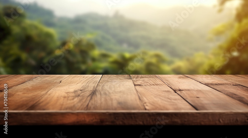 Wooden table with mountains in the background, space for product or advertising