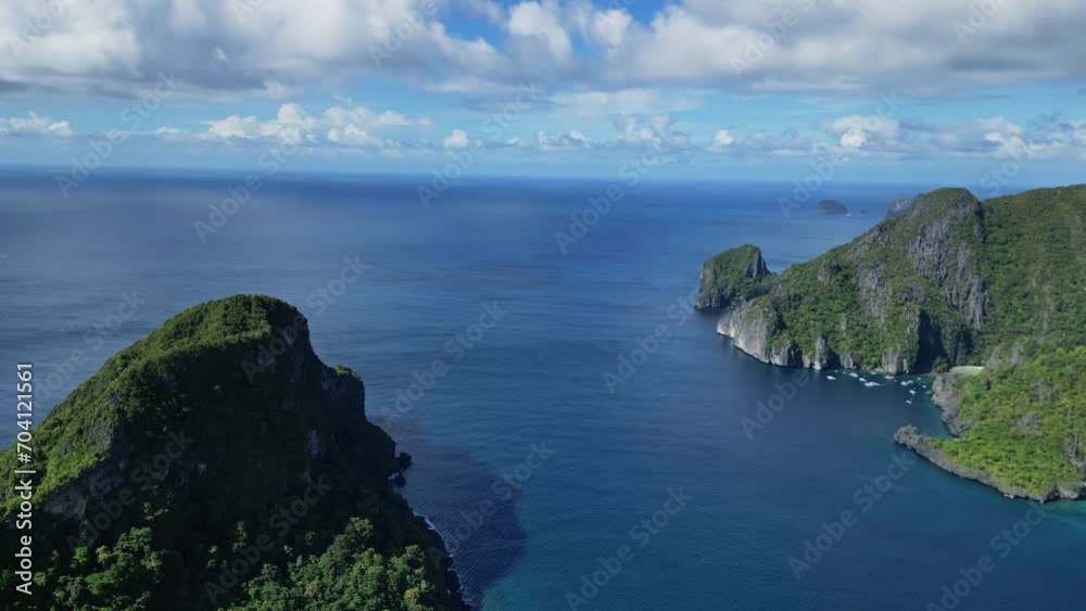 Aerial view of tropical Philippines islands. White sand beach, rocks cliffs mountains with blue bay and coral reef, 4k Aerial view of tropical Philippines islands. White sand beach, rocks cliffs mountains with blue bay and coral reef, 4k
