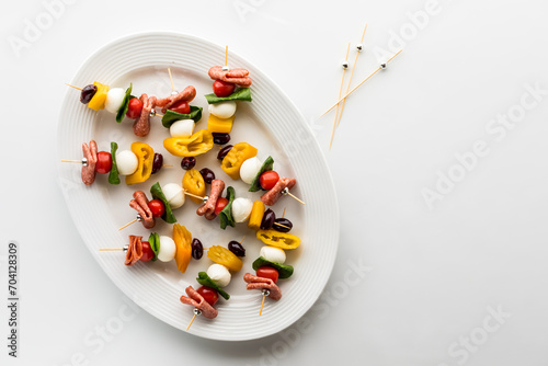 Obraz na plátně A platter of colourful antipasto kebab appetizers with copy space to the right