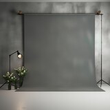 Gray photography studio background with spotlight and flowers