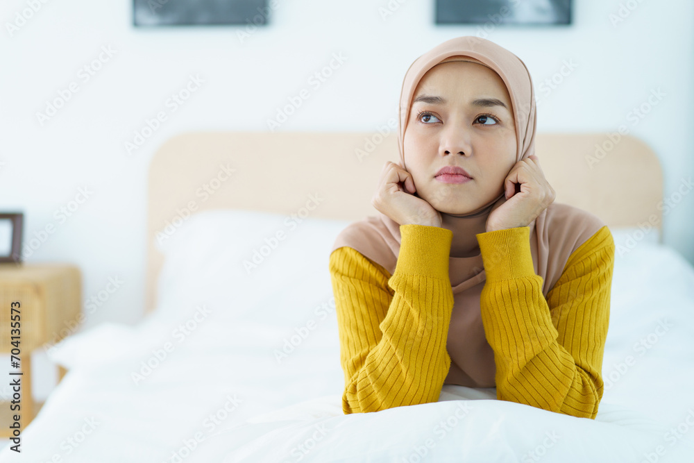 Asian muslim woman having a mental burn out or depression problem from working and social environment. Asian muslim woman having a mental burn out or depression problem from working and social environment.