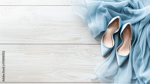 Blue party dress and high heels - flat lay graphic banner on wood background photo