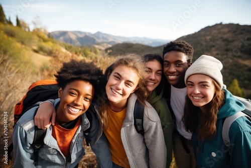 Group of diverse teenagers on a hiking trip in the mountains