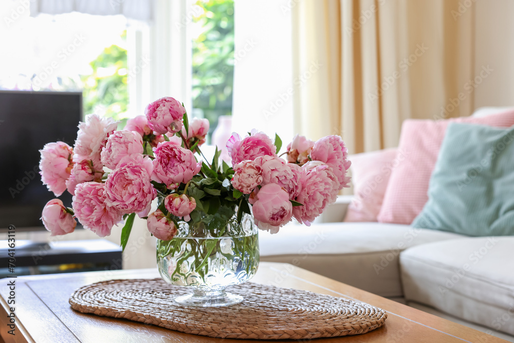 Beautiful pink peonies in vase on table at home, space for text. Interior design - obrazy, fototapety, plakaty 