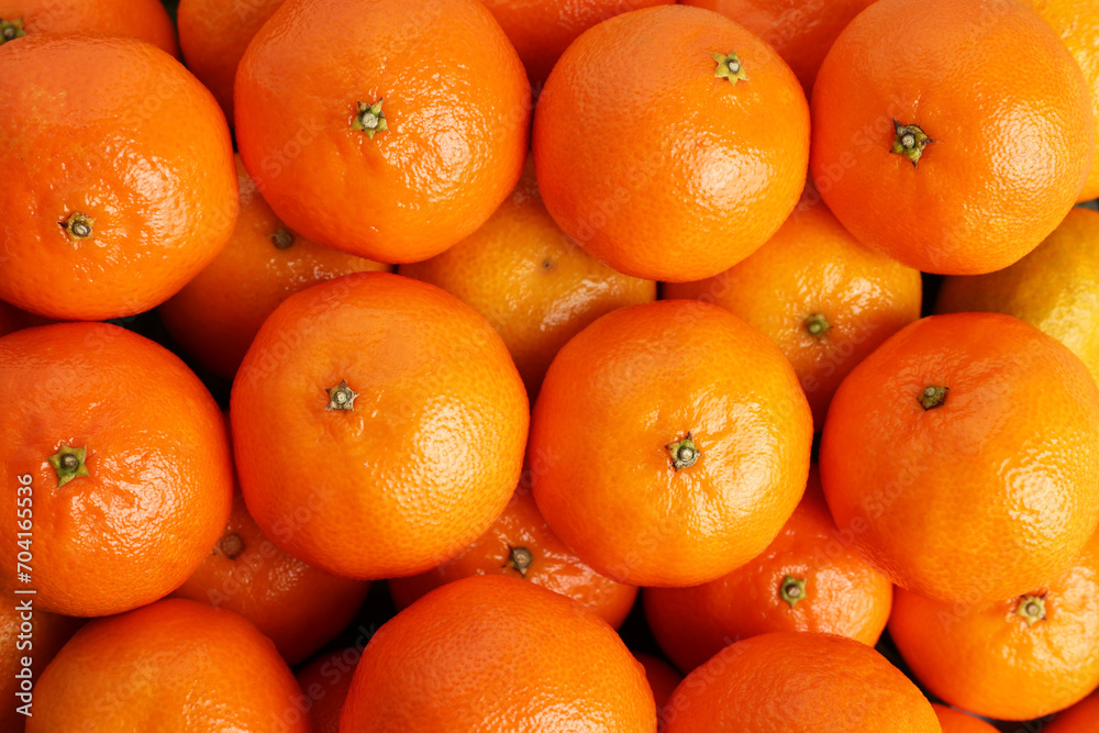 Delicious fresh tangerines as background, top view Delicious fresh tangerines as background, top view