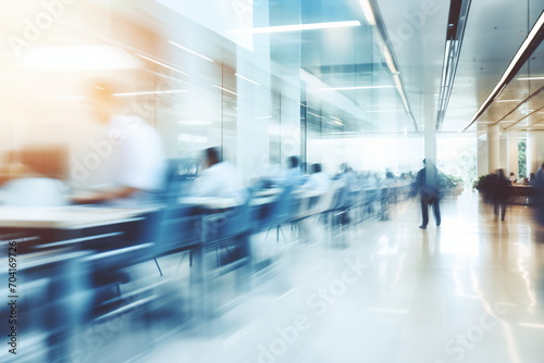 Blurred motion of people walking in a modern office building © duyina1990