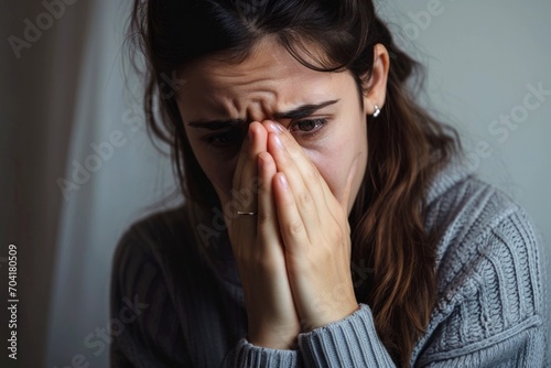 Sad depressed desperate grieving crying woman with folded hands and tears eyes during trouble, life difficulties, depression and mental emotional problems
