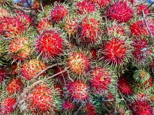 Top view of Rambutan fruits background at a market .