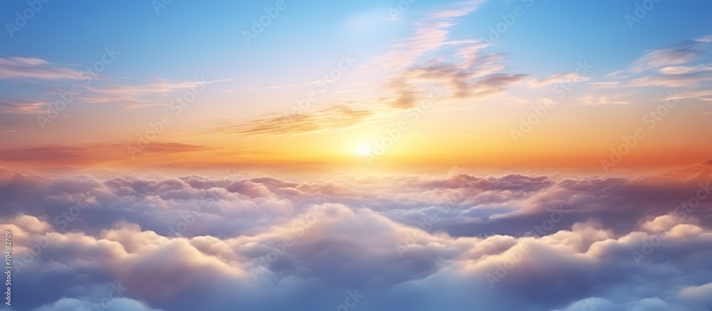 Ethereal Sunrise Above Soft Clouds