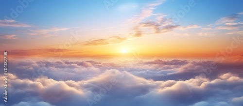 Ethereal Sunrise Above Soft Clouds