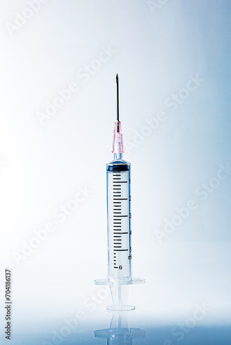 Macro syringe,A 5ml syringe and needle isolated on a white background with detailed clipping path,Close up of a syringe. Focus on numbers photo