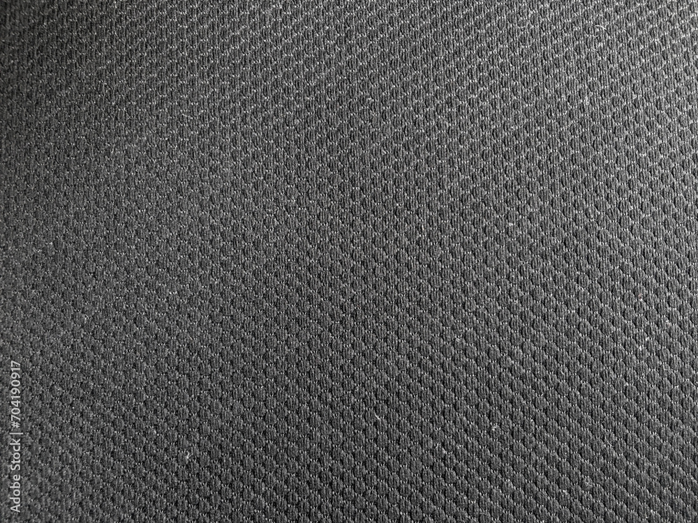 The play of light on the dark surface adds dimension to the abstract pattern, enhancing its visual appeal. The play of light on the dark surface adds dimension to the abstract pattern, enhancing its visual appeal.