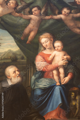 VICENZA, ITALY - NOVEMBER 6, 2023: The detail of painting Madonna with the St. Philip Neri in the church Chiesa di San Filippo Neri by unknown artist. 